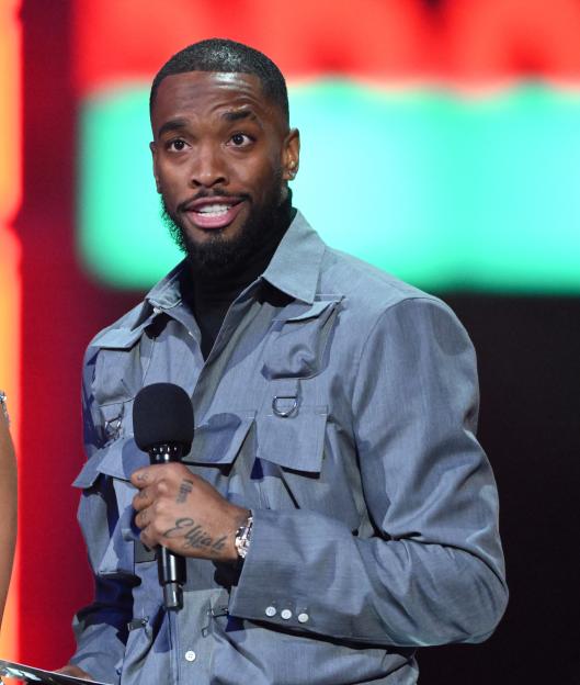 Vick Hope and Ivan Toney on stage during the BRIT Awards 2024.