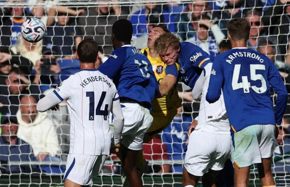 Emiliano Martinez of Chelsea clashes with Jarrad Branthwaite of Everton during an English Premier League match.