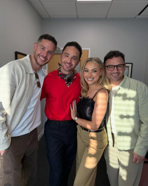 Adam Thomas posing with his brothers and wife.