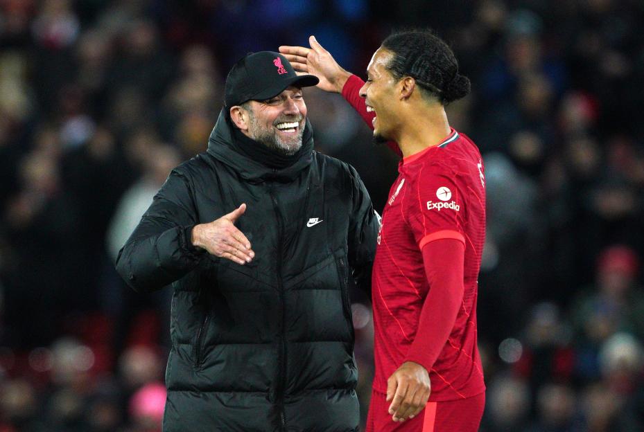 Liverpool manager Jurgen Klopp and Virgil van Dijk smiling.