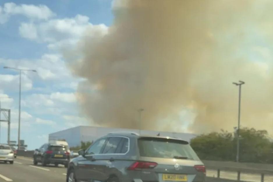 Massive Blaze Near Railway Disrupts Trains to UK's Busiest Station, Motorists Choked by Thick Smoke on Major Motorway