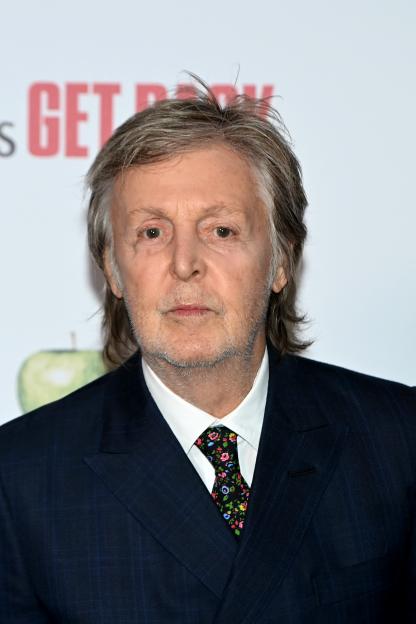 Paul McCartney on a red carpet.