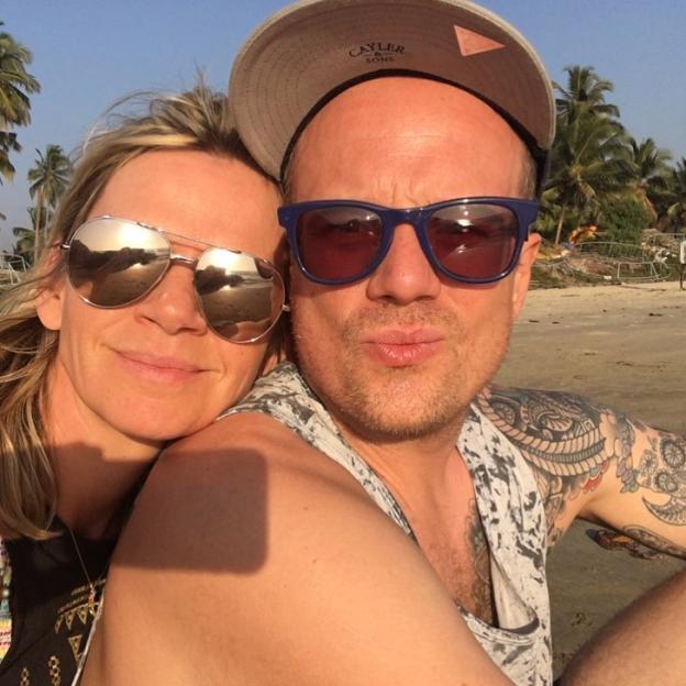 Zoe Ball and Billy Yates posing on a beach.