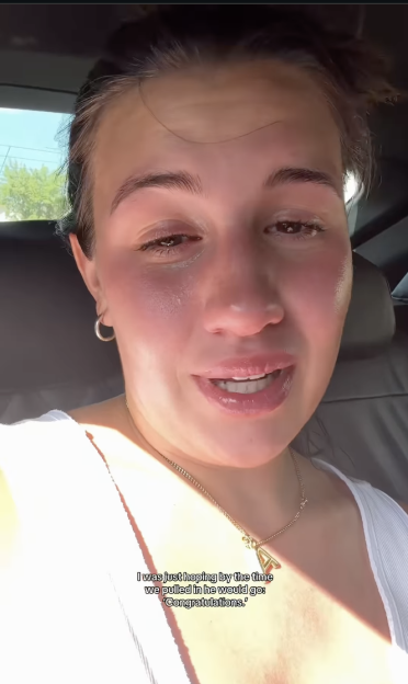 A woman in a car, emotional and looking at the camera, with text overlay: "I was just hoping by the time we pulled in he would go: 'Congratulations.'"