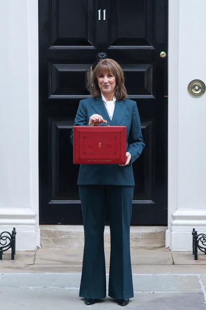 Rachel Reeves posing with the red budget box outside 11 Downing Street.