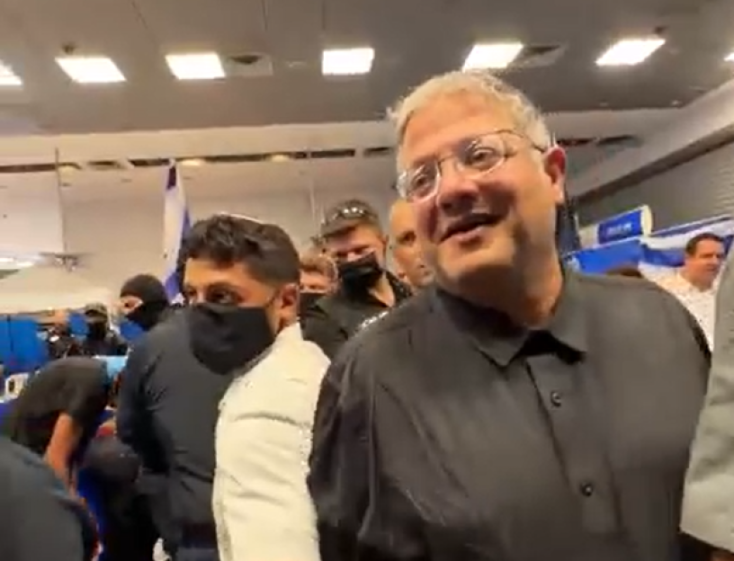 Irtamar Ben-Gvir, the Israeli Minister for National Security, among a crowd of people.