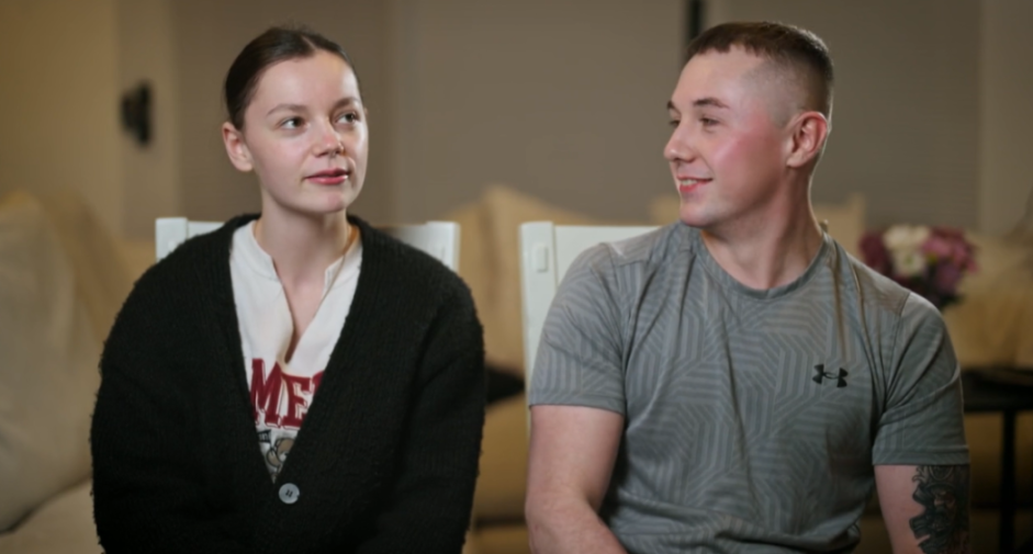 Ellie Radford and her boyfriend sitting and looking at each other.