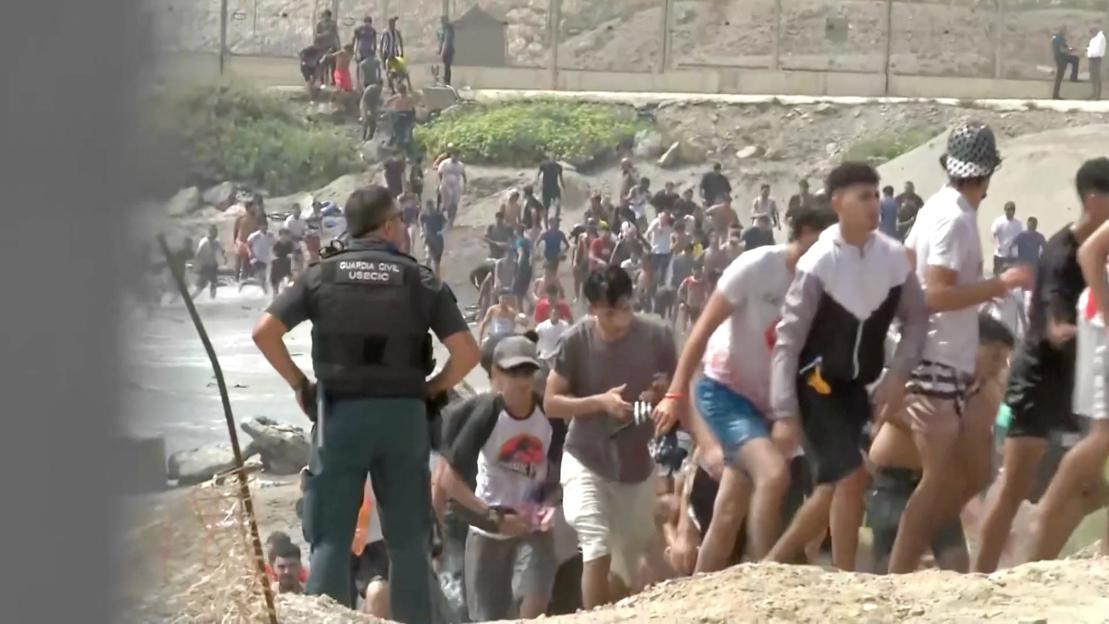 Migrants swim to Spain's Ceuta in mass border crossing