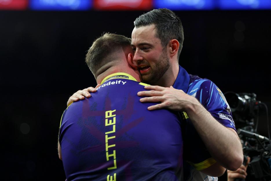 Luke Humphries embracing Luke Littler at the 2026 BetMGM Premier League Darts Final.
