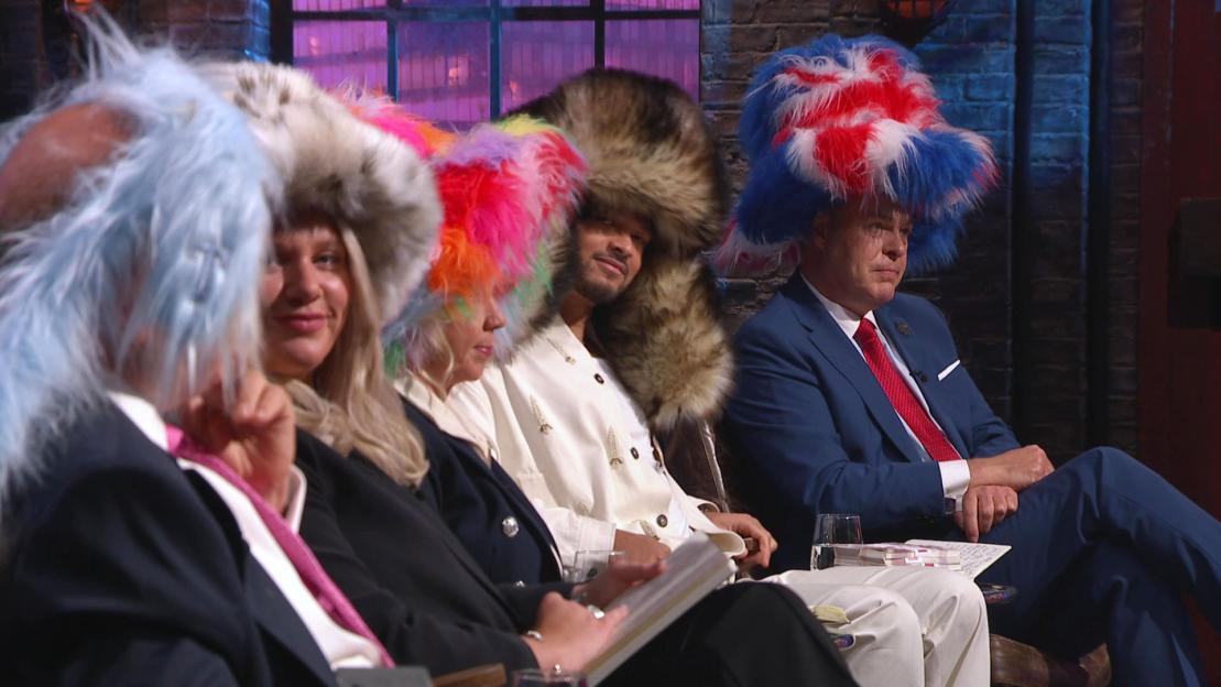 Touker Suleyman, Jenna Meek, Deborah Meaden, Steven Bartlett, and Peter Jones wearing hats.