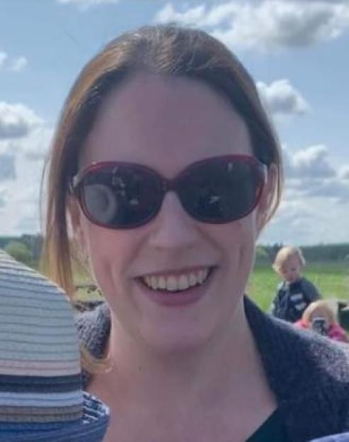 Dr Helen Eisenhauer smiling while wearing sunglasses outdoors.