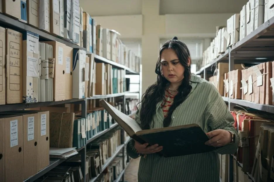 Katie Salter uncovers evidence in a public library archive room.