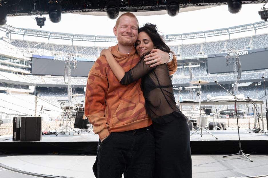 Ed Sheeran and Camila Cabello embrace on stage.