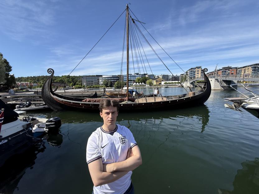 Sun reporter Ed Southgate standing in front of the Viking longship Saga Oseberg.