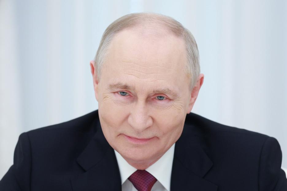 Russian President Vladimir Putin in a meeting.