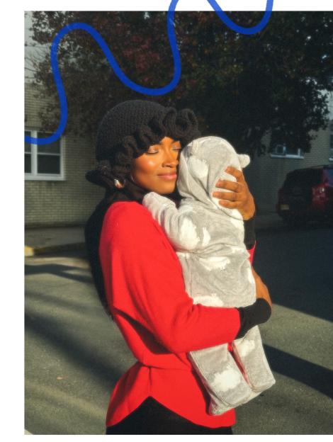 Aïssata Diallo holding her baby son.