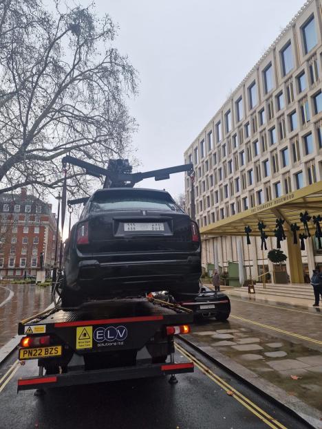 Rolls Royce being towed from Grosvenor Square by Westminster City Council due to illegal parking.