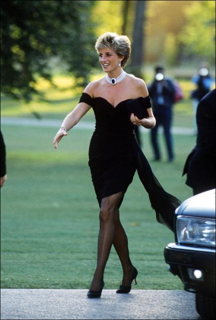 Princess Diana arriving at the Serpentine Gallery in a black evening gown.