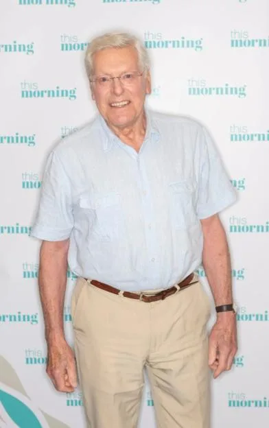 Peter Purves posing on the set of the television show "This Morning".