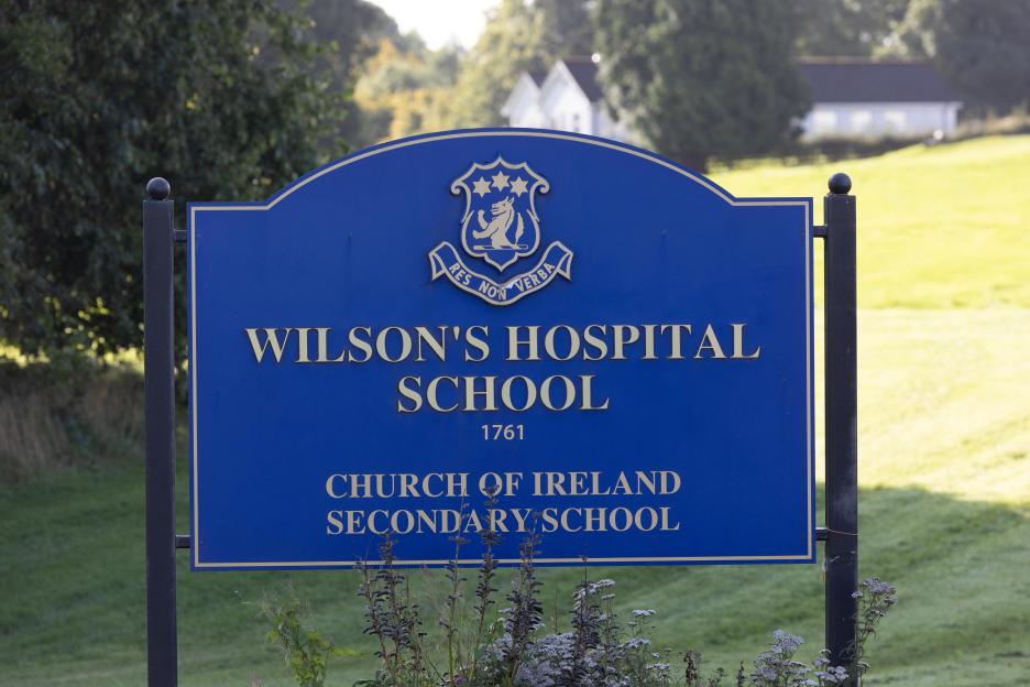 Blue sign for Wilson's Hospital School, Church of Ireland Secondary School, with its crest.