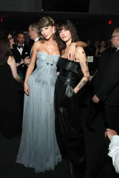 Taylor Swift and Cara Delevingne pose together at the Academy Museum Gala.