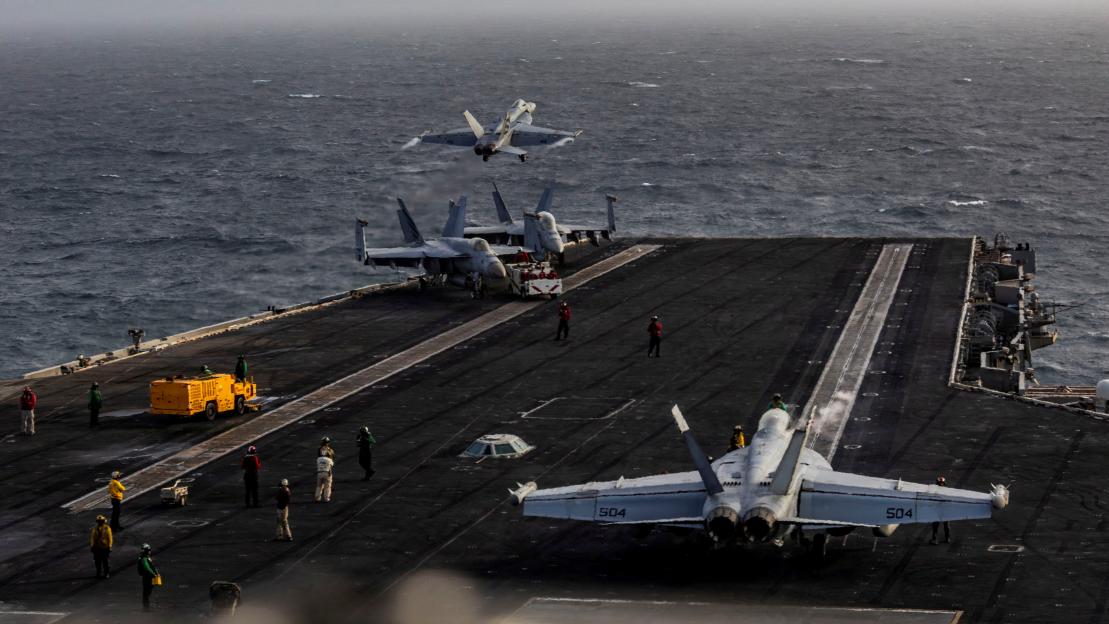 : An F/A-18E Super Hornet launches from the flight deck of Nimitz-class aircraft carrier USS Abraham Lincoln