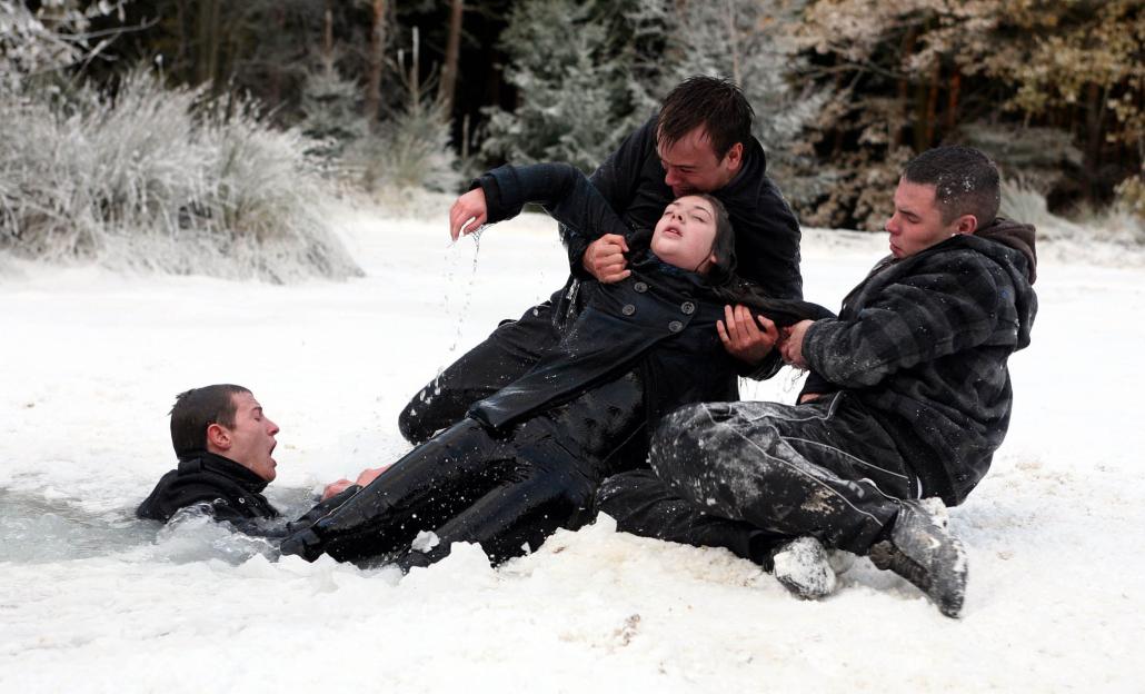 Daz Eden rescuing Victoria Sugden from breaking ice while Jake Doland, Scarlett Nicholls, and Aaron Livesy look on.