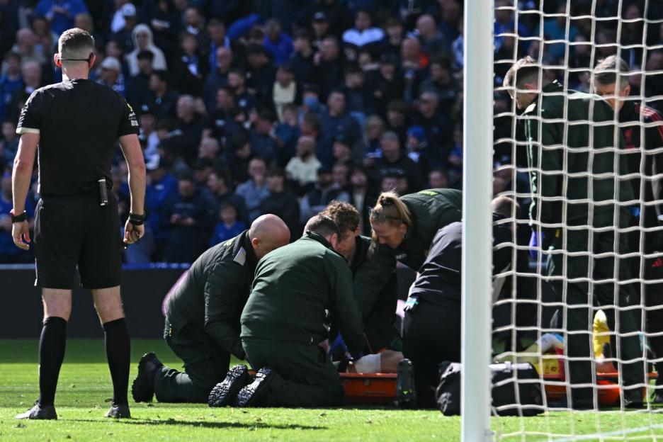 Liverpool's Giorgi Mamardashvili Carted Off Against Everton, Prompting Arne Slot to Rely on Third-String Keeper
