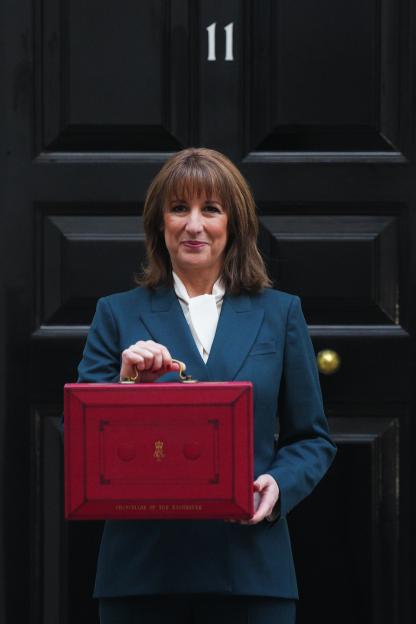 Chancellor of the Exchequer Rachel Reeves posing with the red Budget Box in front of 11 Downing Street.