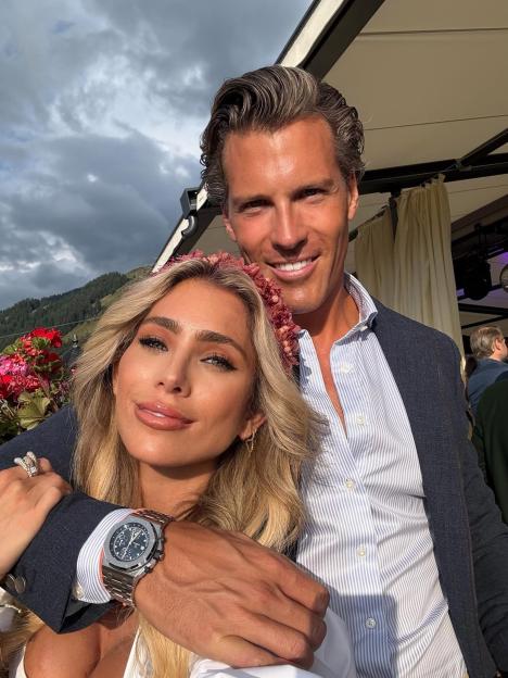 Philip Ostermann and Melissa Rein Lively smiling in an outdoor selfie.