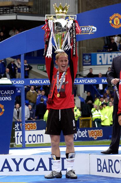 Nicky Butt lifts the Premiership trophy.