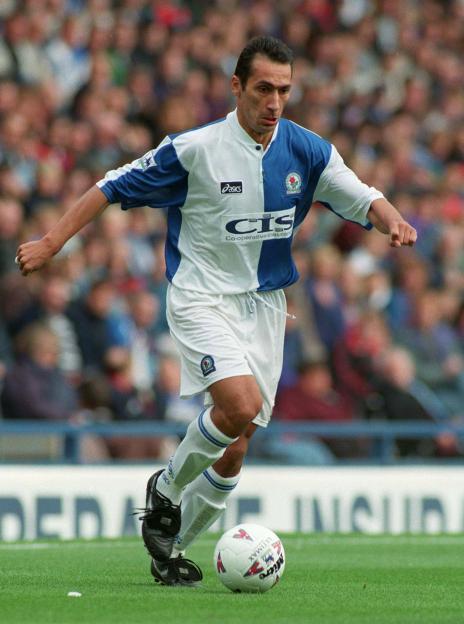 Blackburn Rovers player, Jason Wilcox, dribbling the ball during a Premier League match against Everton.