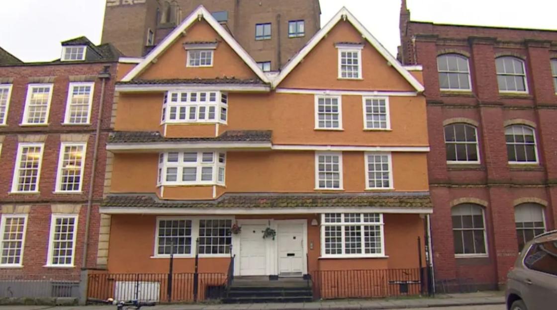 The exterior of the Partou Nursery in King Street, Bristol, which has two white doors and many large windows.