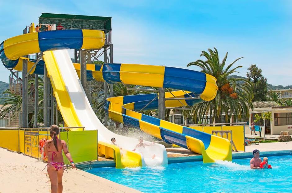 People enjoying waterslides in a water park.