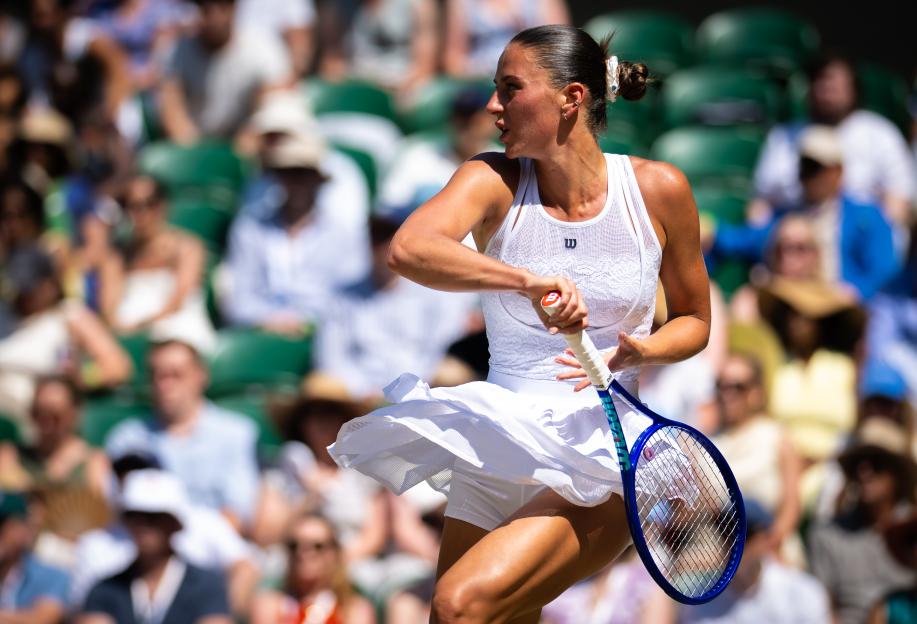 Marta Kostyuk of Ukraine in action during a tennis match.