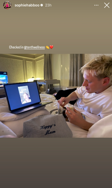 Jamie Laing feeding his baby while on a video call