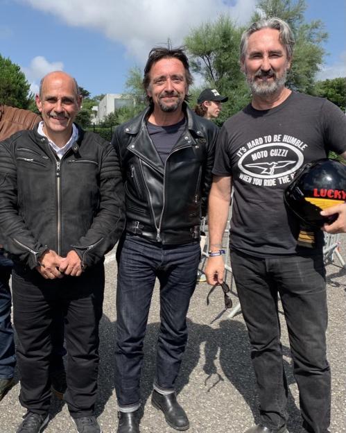 Richard Hammond and two men wearing motorcycle jackets and a "Moto Guzzi" t-shirt.