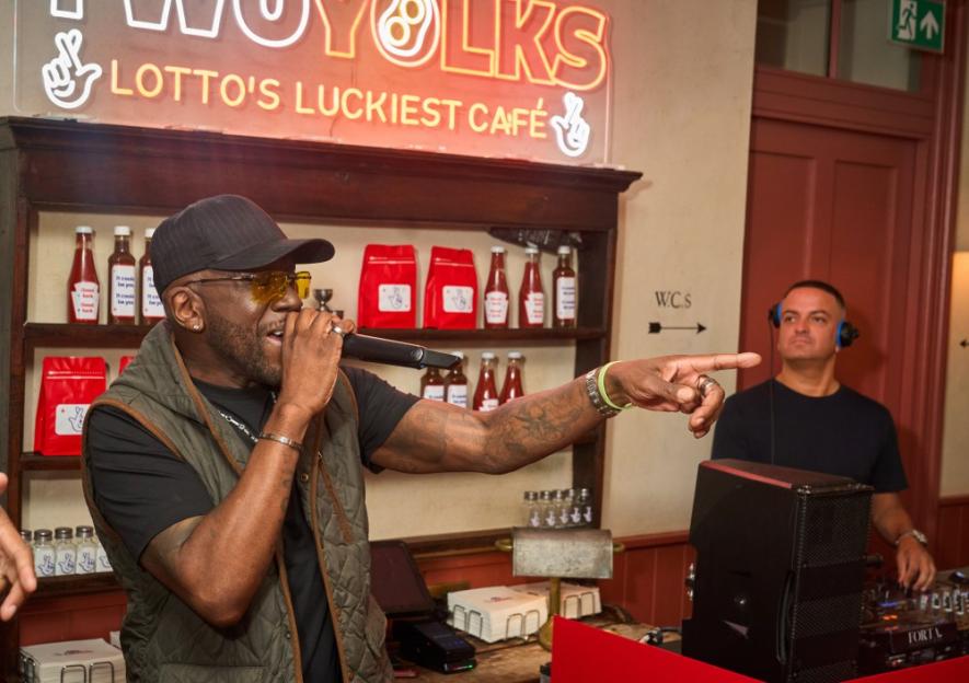 DJ Luck and MC Neat performing at Lotto's Luckiest Cafe.