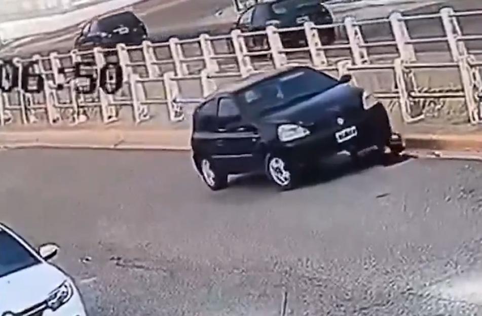Security footage of a woman being knocked over and crushed by her car.