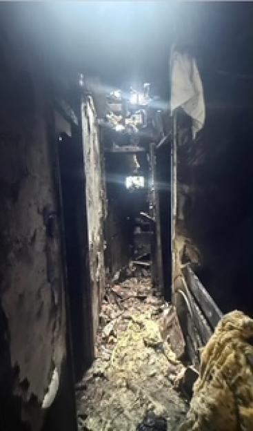 The charred interior of a home after an e-scooter fire.