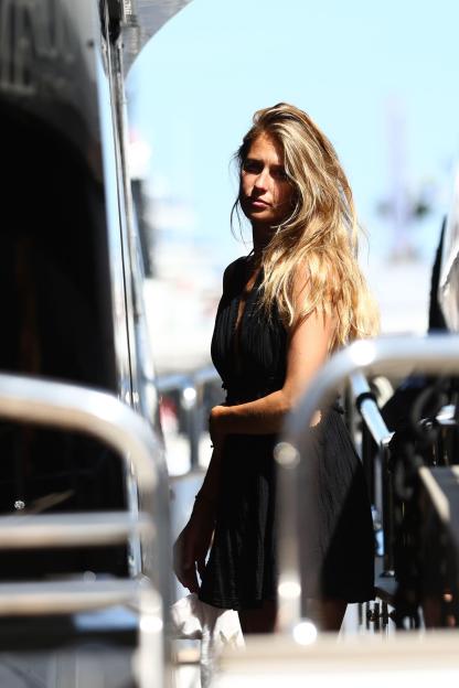 A spectator with long blonde hair and a black dress on a yacht at the Formula 1 Grand Prix of Monaco 2026.