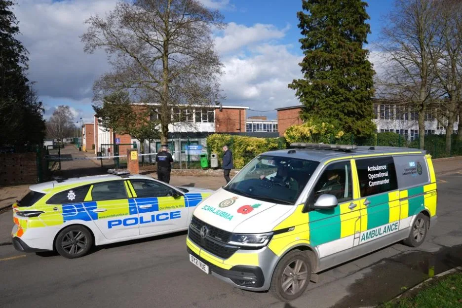 Police and ambulance vehicles parked outside Thorpe St Andrew School in Norwich.