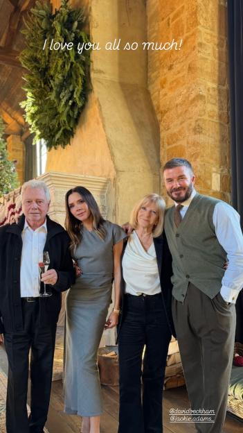 Victoria and David Beckham posing with their parents at Christmas.