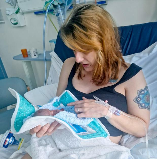 Corrinne Boulton holds her baby Albie.