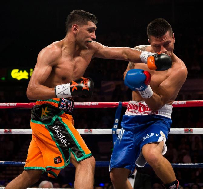 Amir Khan punching Julio Diaz during their boxing match.