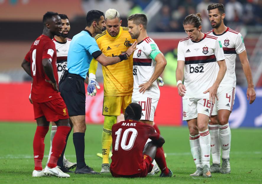 Players of CR Flamengo confront referee Abdulrahman Al Jassim after a foul call involving Sadio Mane of Liverpool during the FIFA Club World Cup Qatar 2019 Final.