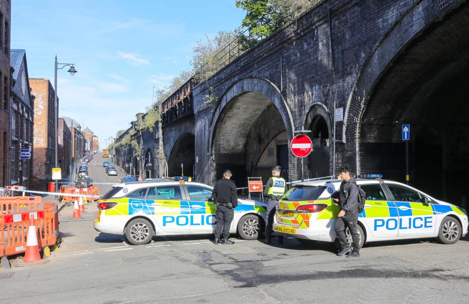 Police officers and cars on Livery Street in Birmingham following a deliberate car attack.