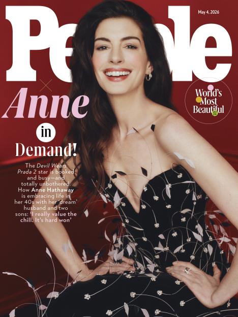 Anne Hathaway smiling on the cover of People Magazine's "World's Most Beautiful" issue.