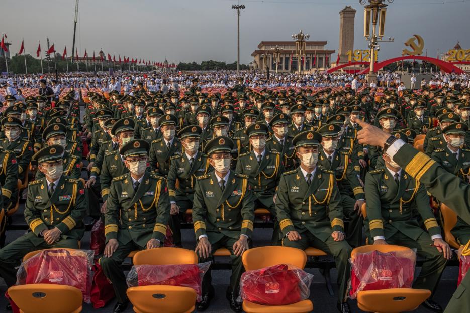Military personnel in uniform and masks seated at the 100th anniversary celebration of the Chinese Communist Party.