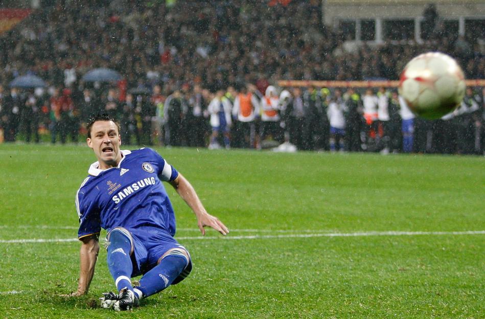 Footballer John Terry on the ground in the rain, having missed a penalty kick in the Champions League Final.